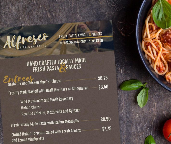 A visually appealing web design showcases a menu featuring a delectable selection of pasta and vegetables.