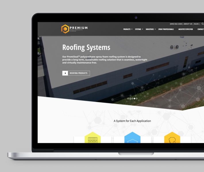 The website for roofing systems is showcased on a laptop, emphasizing the brand.