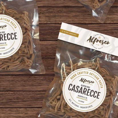 Two bags of casseree displayed on a wooden table showcasing a stylish branding design.