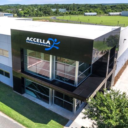 An aerial view of the Accella manufacturing facility, showcasing its modern design and strong branding.